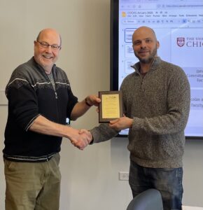 Michael Franklin and Aaron Elmore holding award