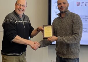 Michael Franklin and Aaron Elmore holding award